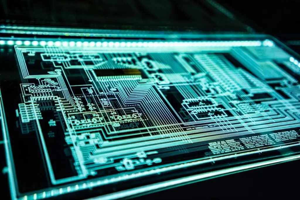 Illuminated circuit board schematic with cyan LED lighting representing modern IT infrastructure